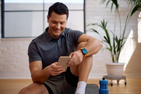 happy-athletic-man-using-app-smart-phone-home-workout_1326977-17049 Fitness Tracker